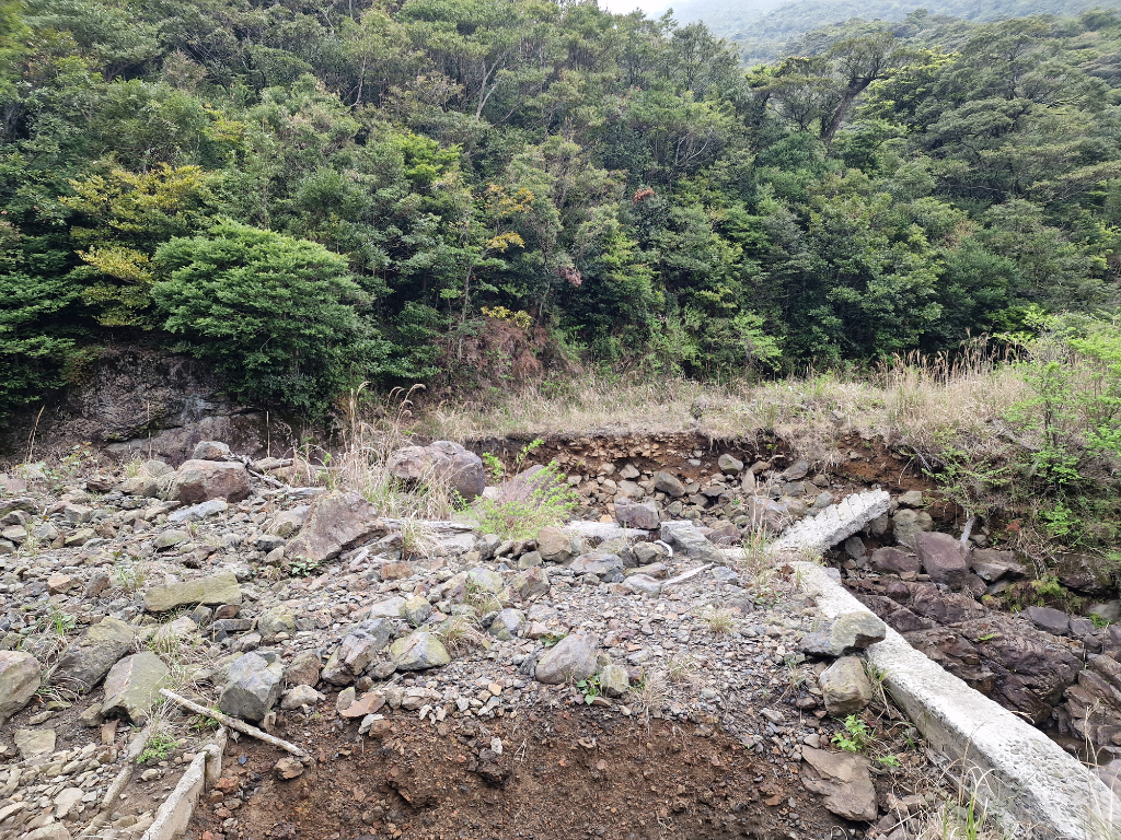 Rocks piled up and a hole where a bridge should have been