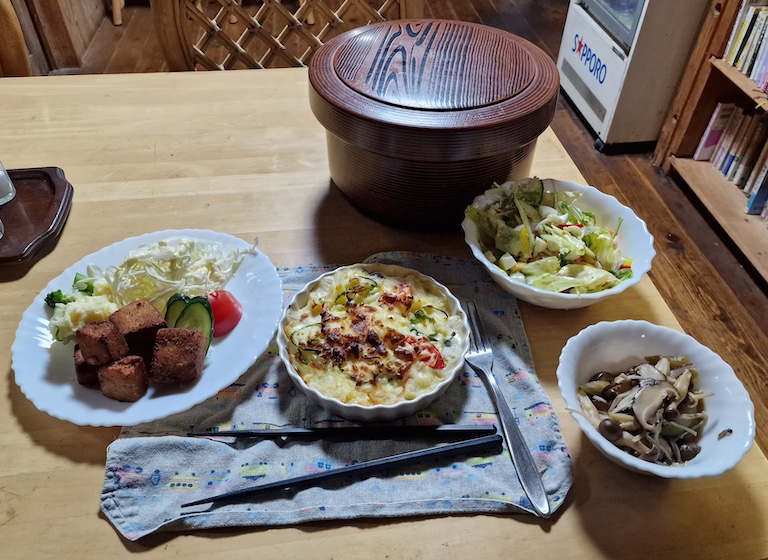 Different vegetarian dishes like fried tofu, mushroom, and rice