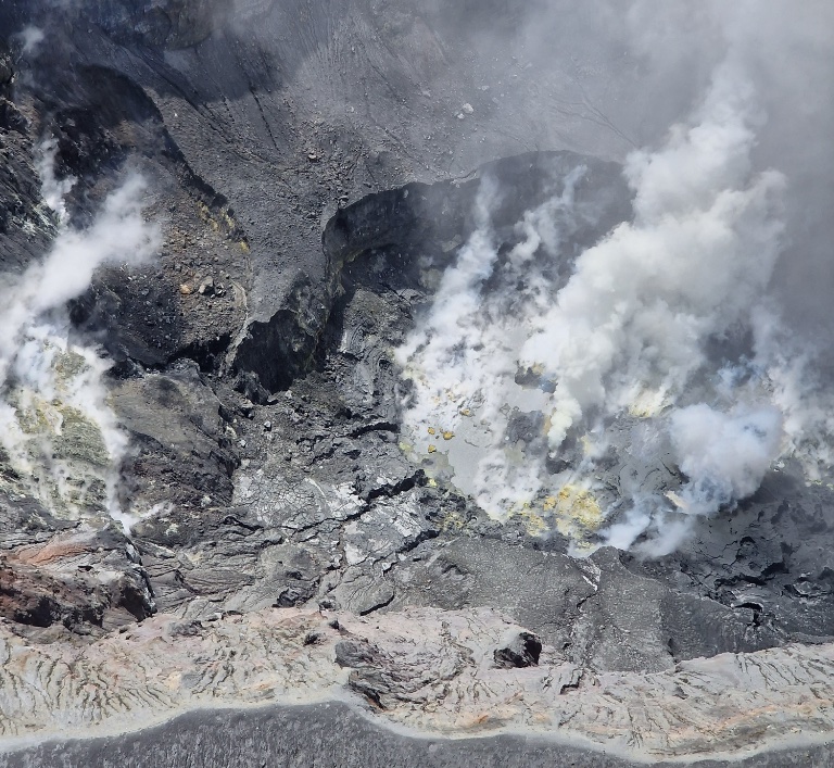 Fumes, silt, and sulfur pits inside the volcano