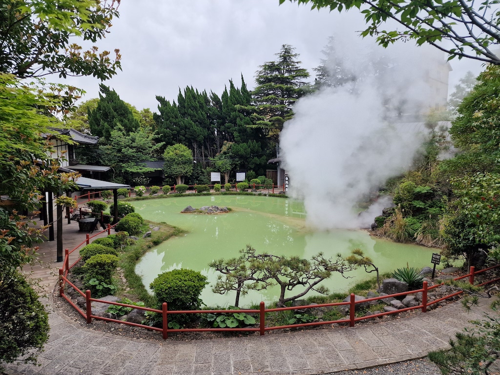 A steaming green pool of really hot water