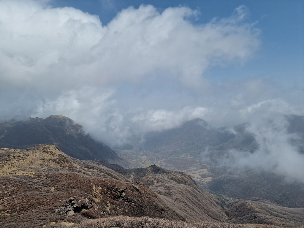 Clouds moving away from the mountains