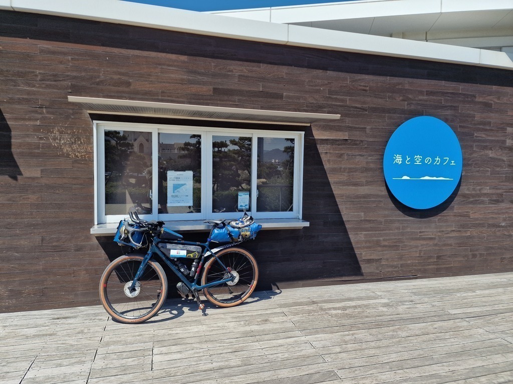 My bike leaning on the information window of a stamp location