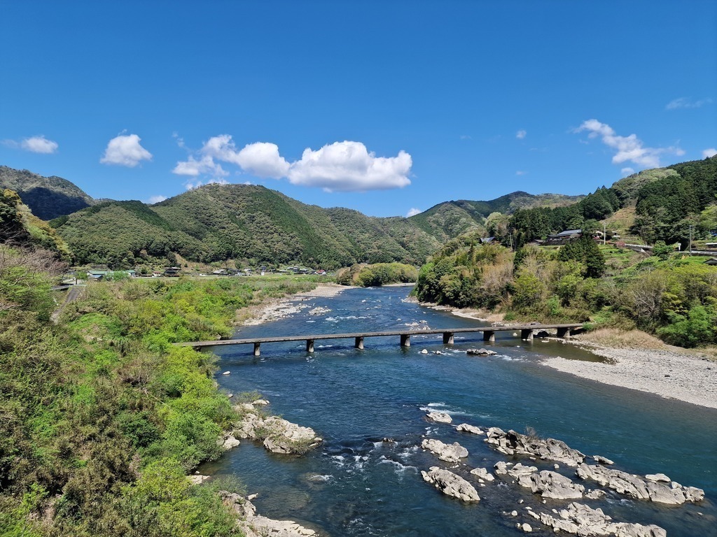 Scenic view of the river with a shallow bridge crossing it