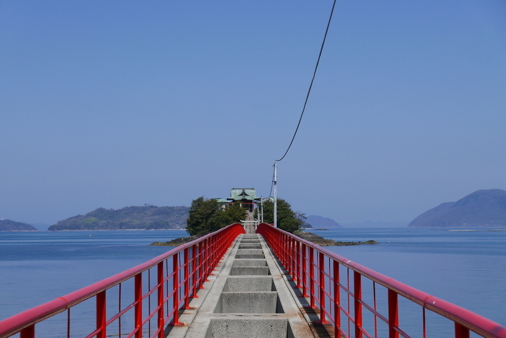 A bridge with no floor leading to a shrine